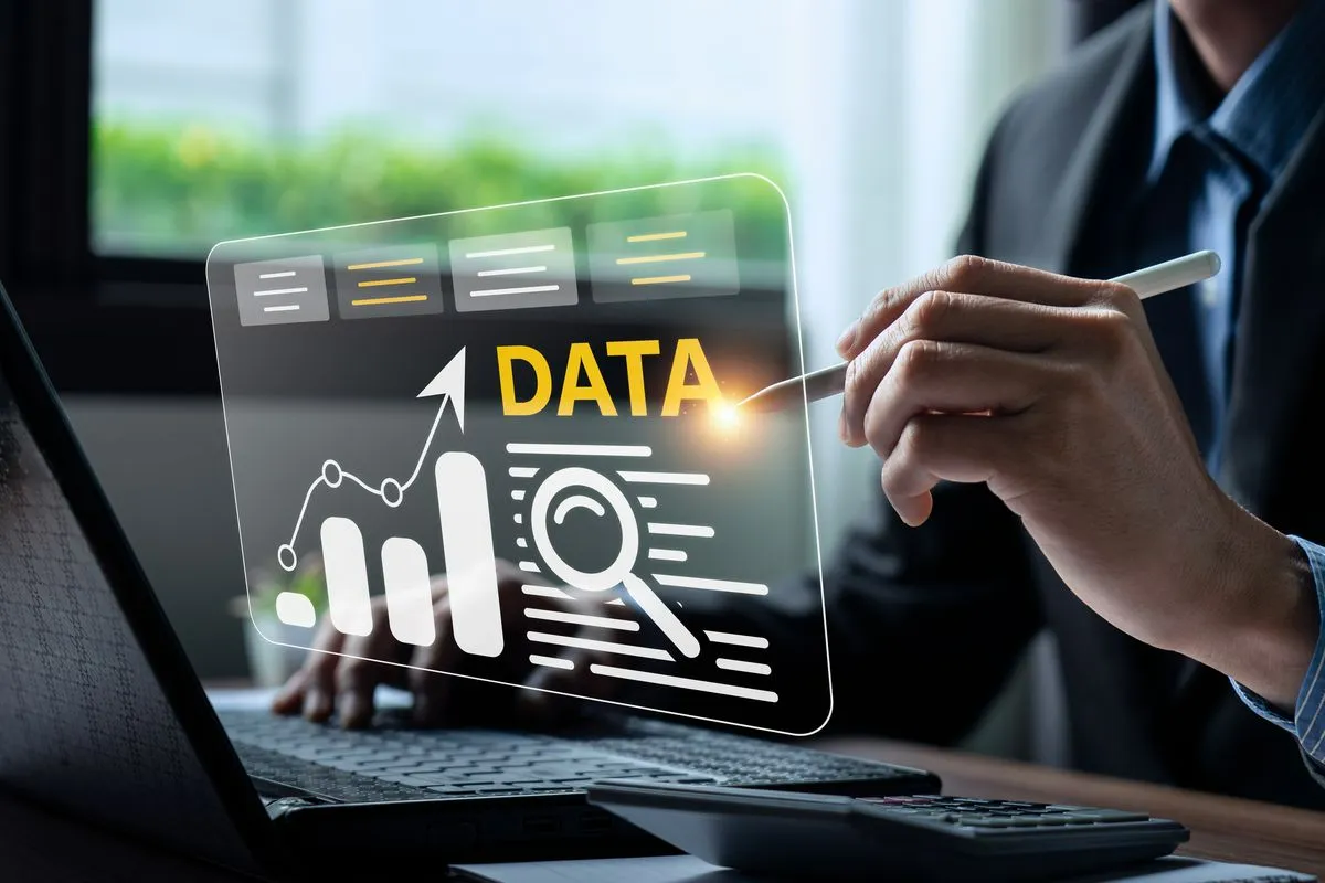 Analyst reviewing data dashboards and visualizations on a screen